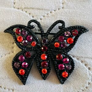 Elegant Black Butterfly Brooch with Red and Pink Accents